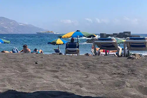 Los Cancajos beach with dark sand and lava barriers on La Palma