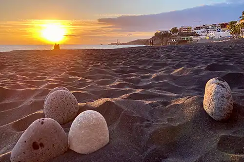 Puerto Naos beach with black volcanic sand and promenade on La Palma